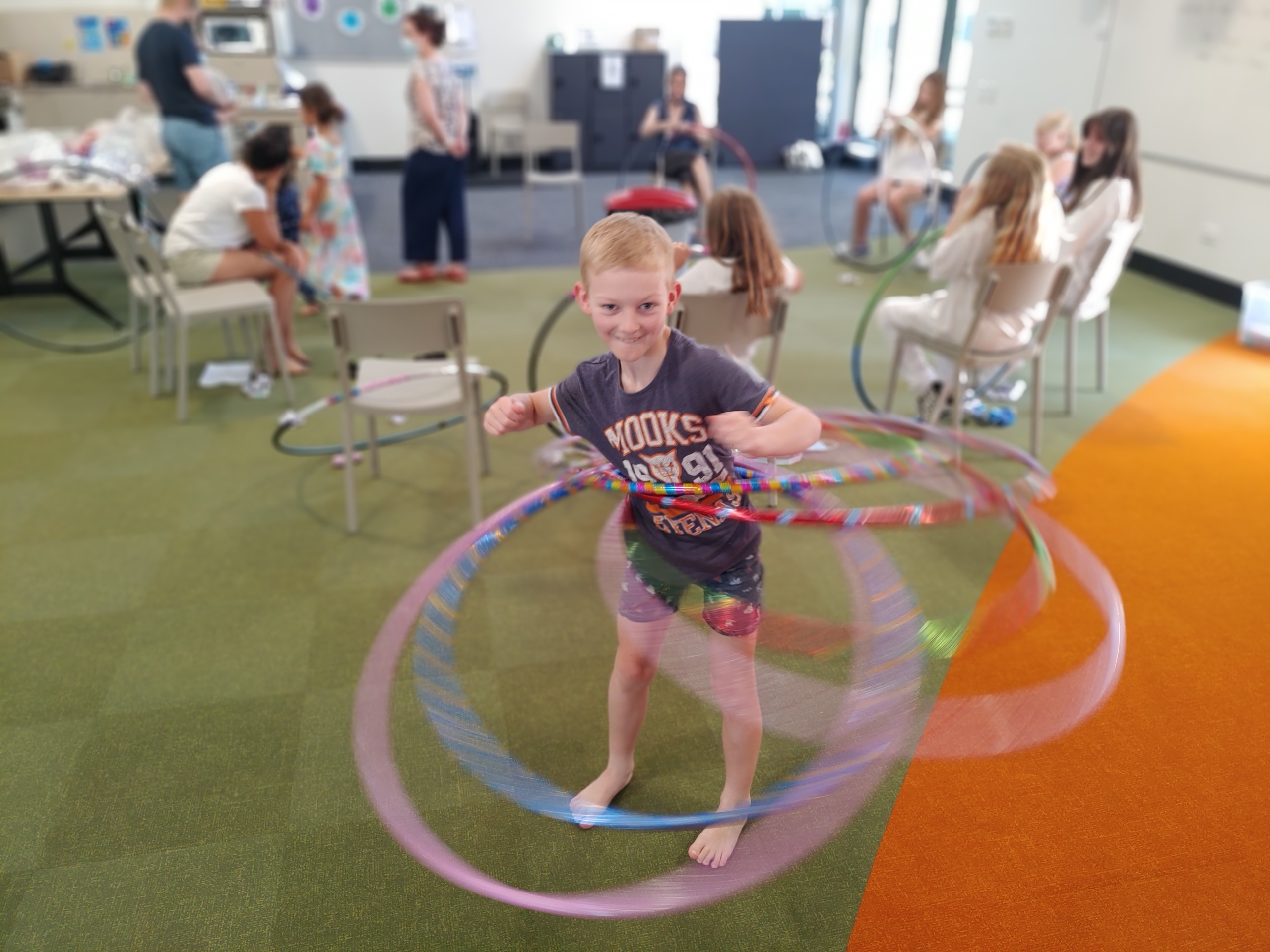 Children swinging a houla hoop