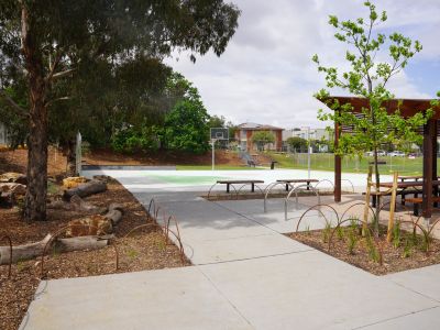 Photo showing multi purpose court, picnic shelter and spots to sit and relax